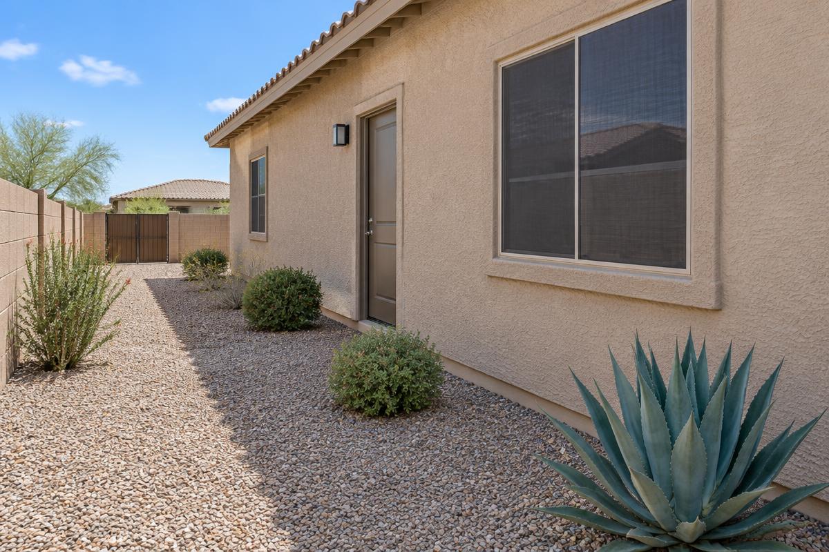 Arizona stucco home side yard with gravel landscaping